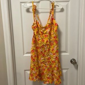 Summer dress, floral, ties in the back and has zipper.